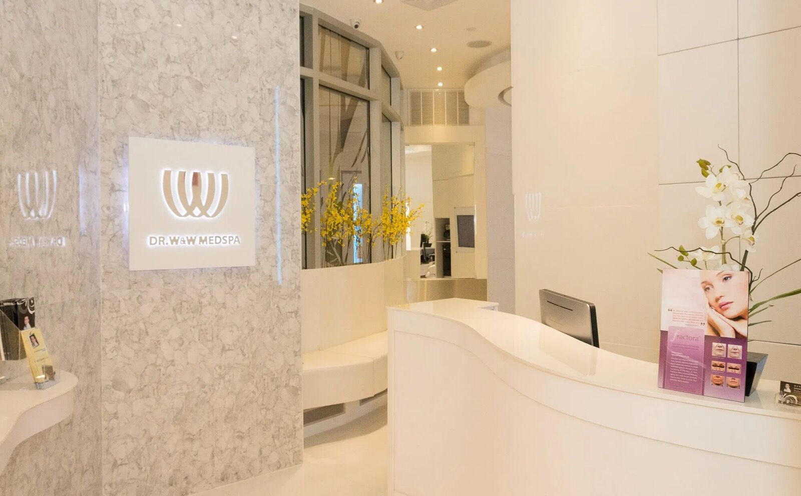 Reception desk with the W&W logo Reception desk with the W&W logo at a DR WW Dermatology office in New York